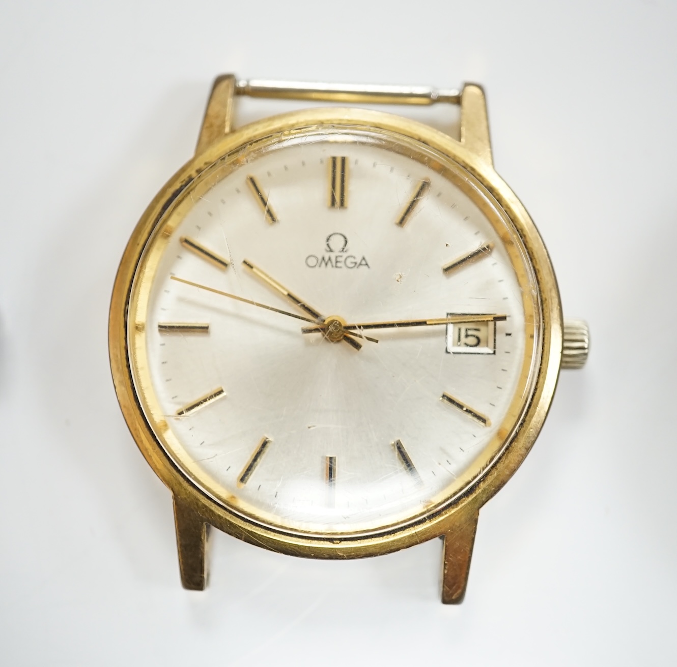 A gentleman's steel and gold plated Omega manual wind wrist watch, no strap, case diameter 35mm, together with a lady's silver wrist watch and a pocket watch. Condition - varies